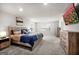 Spacious bedroom with a wooden bed frame, two dressers and plush carpet flooring at 838 Maduro Way, Mcdonough, GA 30253