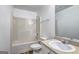 Neutral toned bathroom featuring a tub and shower combination, sink, and wood-look flooring at 325 Espana St, South Fulton, GA 30349