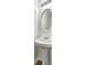 Clean pedestal sink in bathroom, complemented by a round mirror and modern lighting fixture at 325 Espana St, South Fulton, GA 30349