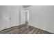 Bedroom with wood-look floors, closet, and natural light offering comfort at 325 Espana St, South Fulton, GA 30349