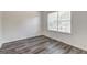 Cozy bedroom with wood-look floors and window for natural light at 325 Espana St, South Fulton, GA 30349