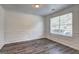 Formal dining room with decorative wall paneling and large window allowing for natural light at 325 Espana St, South Fulton, GA 30349