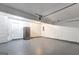 Spacious garage offers room for storage and a car, with ample lighting overhead at 325 Espana St, South Fulton, GA 30349