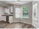 Bright breakfast nook area with large windows that provide ample natural light and views of the outdoors at 325 Espana St, South Fulton, GA 30349
