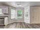 Charming dining area with bright windows and modern wood-look flooring, great for casual meals at 325 Espana St, South Fulton, GA 30349