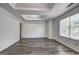 Bright main bedroom with recessed ceiling, and expansive window that provides natural light and views at 325 Espana St, South Fulton, GA 30349