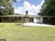 Spacious backyard features brick home, concrete patio, and green lawn at 4313 Executive Dr, Stone Mountain, GA 30083