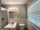 Clean bathroom with a shower, toilet, and vanity with bright lighting at 4313 Executive Dr, Stone Mountain, GA 30083