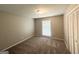Cozy bedroom with carpeted floors, a closet, and natural light at 4313 Executive Dr, Stone Mountain, GA 30083