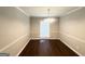 Elegant dining room featuring hardwood floors, chair rail, and modern chandelier, perfect for entertaining guests at 4313 Executive Dr, Stone Mountain, GA 30083