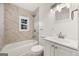 Modern bathroom featuring a tub, marble tiling, and modern fixtures at 2584 Oldknow Nw Dr, Atlanta, GA 30318