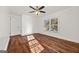 Bedroom featuring hardwood floors, white walls, a ceiling fan, and natural light at 2584 Oldknow Nw Dr, Atlanta, GA 30318