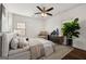 Cozy bedroom with neutral decor, ceiling fan, and natural light at 2584 Oldknow Nw Dr, Atlanta, GA 30318