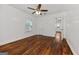 Bedroom with hardwood floors, a ceiling fan, and an ensuite entrance at 2584 Oldknow Nw Dr, Atlanta, GA 30318