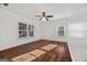 Bright bedroom featuring hardwood floors, a ceiling fan, and ample natural light at 2584 Oldknow Nw Dr, Atlanta, GA 30318