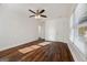 Bedroom featuring hardwood floors, white walls, a ceiling fan, and natural light at 2584 Oldknow Nw Dr, Atlanta, GA 30318