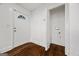 Bright foyer with hardwood floors and a convenient coat closet at 2584 Oldknow Nw Dr, Atlanta, GA 30318