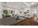 Open living room with hardwood floors, bay window, and stylish decor at 2584 Oldknow Nw Dr, Atlanta, GA 30318