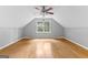 Finished attic space featuring hardwood floors, fan and window at 224 Claridge Curv, Peachtree City, GA 30269