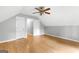 Finished attic space featuring hardwood floors, two closets and white doors at 224 Claridge Curv, Peachtree City, GA 30269