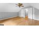 Finished attic space featuring hardwood floors, fan and gray walls at 224 Claridge Curv, Peachtree City, GA 30269