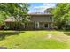 Expansive backyard featuring a well-maintained lawn and a charming two-story home exterior at 224 Claridge Curv, Peachtree City, GA 30269