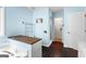 Light and airy bathroom with dark wood look floors, bath and vanity at 224 Claridge Curv, Peachtree City, GA 30269