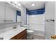 Bathroom featuring a vanity, toilet and tub with blue tile surround at 224 Claridge Curv, Peachtree City, GA 30269