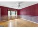 Bright bedroom with hardwood floors, ceiling fan, and large windows at 224 Claridge Curv, Peachtree City, GA 30269