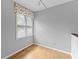 Bright bedroom with hardwood floors and a window with blinds and floral valance at 224 Claridge Curv, Peachtree City, GA 30269