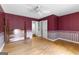 Bedroom featuring hard wood floors, ceiling fan, and large windows at 224 Claridge Curv, Peachtree City, GA 30269