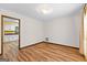 Bedroom with hardwood floors and doorway views into a kitchen space at 224 Claridge Curv, Peachtree City, GA 30269