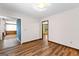 Bedroom with hardwood floors and views into multiple rooms and hallways at 224 Claridge Curv, Peachtree City, GA 30269