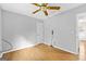 Bedroom with hardwood floors, ceiling fan, and neutral paint at 224 Claridge Curv, Peachtree City, GA 30269