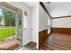 Foyer with hardwood floors, half wall wainscoting, and views into the front yard at 224 Claridge Curv, Peachtree City, GA 30269