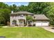 Two-story home with a landscaped front yard and attached two-car garage at 224 Claridge Curv, Peachtree City, GA 30269