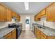 Well-lit kitchen featuring granite countertops, stainless steel appliances, and ample cabinet space at 5669 Blackberry Row, Ellenwood, GA 30294
