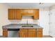 Functional kitchen with granite countertops, stainless steel appliances, and wood cabinetry at 5669 Blackberry Row, Ellenwood, GA 30294