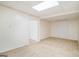 Finished basement area featuring neutral carpeting and a drop ceiling at 225 S South Shore Ter, Fayetteville, GA 30214