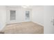 A light and airy bedroom with two windows and neutral carpeting at 225 S South Shore Ter, Fayetteville, GA 30214