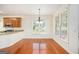 Bright dining area with hardwood floors and a large window overlooking the backyard at 225 S South Shore Ter, Fayetteville, GA 30214