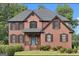 Charming brick home with a well-manicured lawn and a welcoming blue front door at 225 S South Shore Ter, Fayetteville, GA 30214