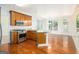 Bright eat-in kitchen with stainless steel appliances, wood floors, and granite countertops at 225 S South Shore Ter, Fayetteville, GA 30214