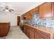 Functional kitchen with stainless steel appliances, tiled backsplash, and wooden cabinets at 225 S South Shore Ter, Fayetteville, GA 30214