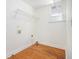 Functional laundry room with a window and a wire shelf at 225 S South Shore Ter, Fayetteville, GA 30214