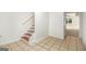 Staircase with tile flooring and open doorway at 225 S South Shore Ter, Fayetteville, GA 30214