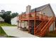 Spacious backyard featuring a wooden deck perfect for outdoor entertaining and relaxation at 95 Revere Turn Drive, Fairburn, GA 30213