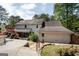 Backyard featuring a patio area, a small stone courtyard, and a partial view of the home's rear exterior at 112 Kirton Turn, Peachtree City, GA 30269