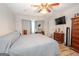 Bedroom featuring a ceiling fan and closet space with natural light at 112 Kirton Turn, Peachtree City, GA 30269