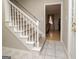 Foyer features a stairway, tile flooring, and an open doorway to the living area at 112 Kirton Turn, Peachtree City, GA 30269